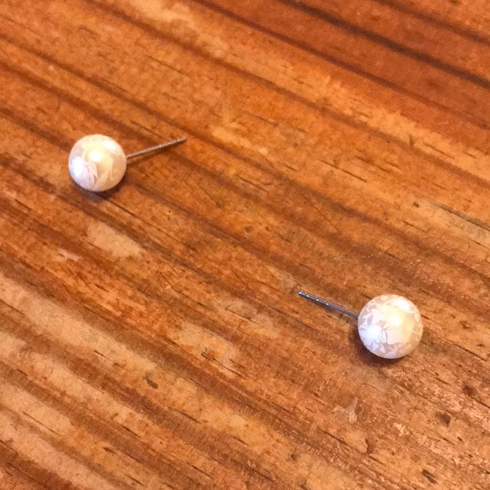 Pearl wit floral designs on it